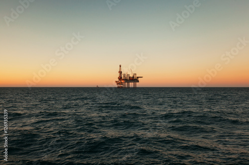 Silhouette of Offshore Jack Up Rig in The Middle of The Sea at Sunset Time. For produce oil and gas fuel © Lukasz Z