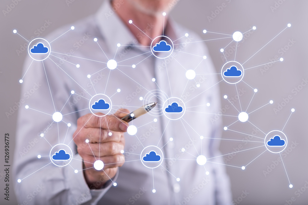 Man touching a cloud networking on a touch screen Man touching a cloud networking on a touch screen