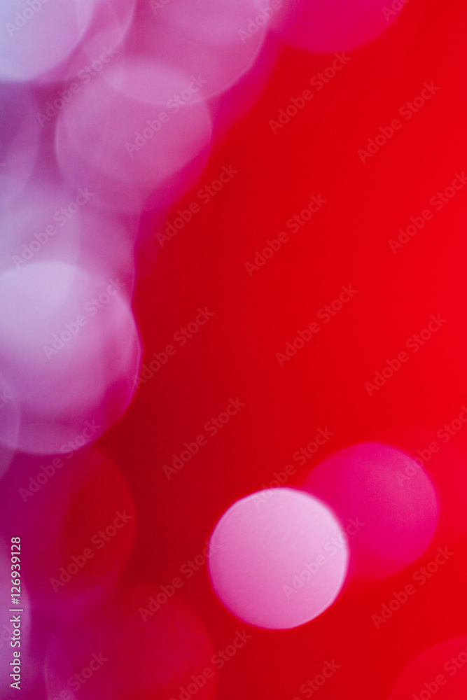 Defocused abstract red background glitter lights round shapes geometric circle.