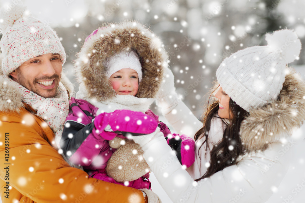 happy family with child in winter clothes outdoors happy family with child in winter clothes outdoors