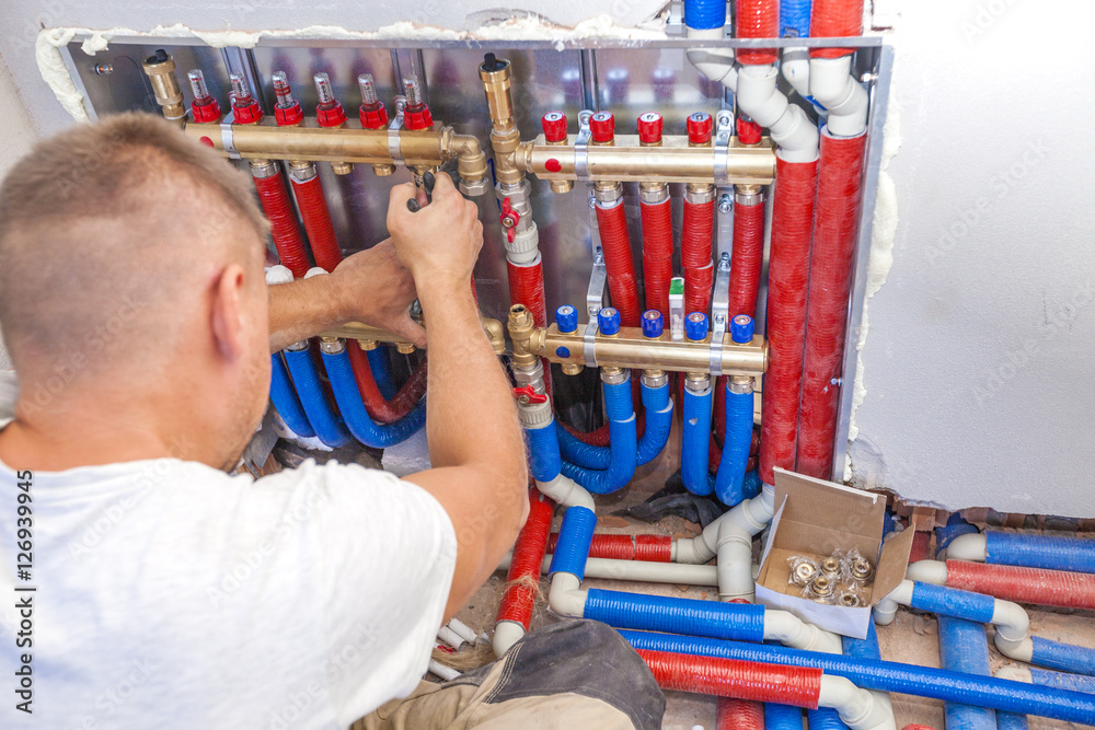 Plumber mounted distributor of central heating. Pipe fittings Central