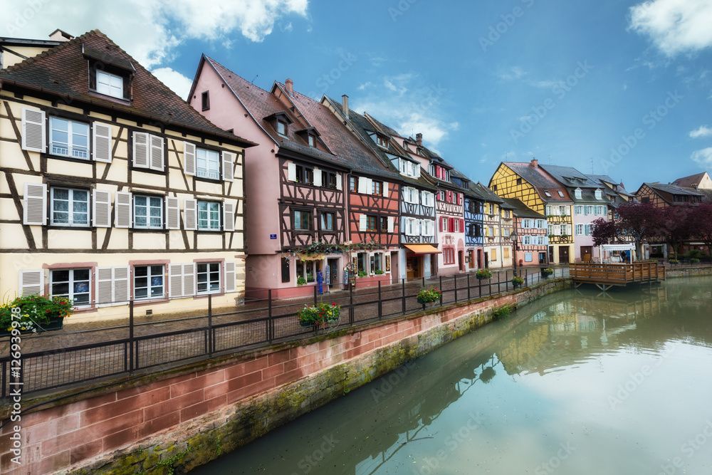 Colorful traditional french houses on the side of river Lauch in Colmar, France.