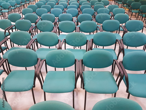 Row of chairs before a speech. 