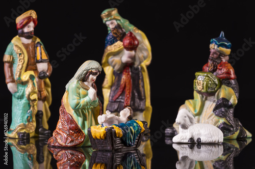 Christmas scene with Jesus and Mary on black background. Focus on Mary!