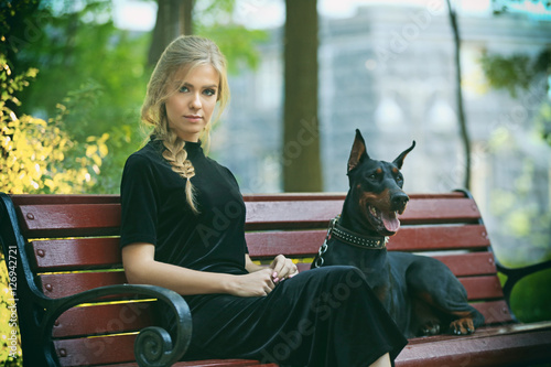 Young woman and her dog res...
