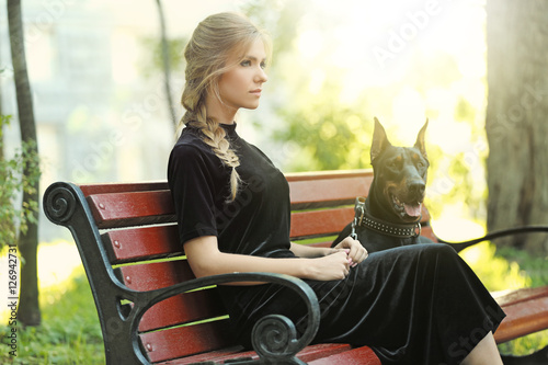 Young woman and her dog res...