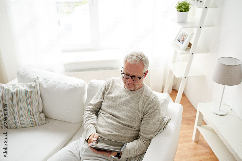 senior man with tablet pc at home senior man with tablet pc at home