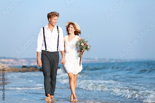 Young happy couple walking ...