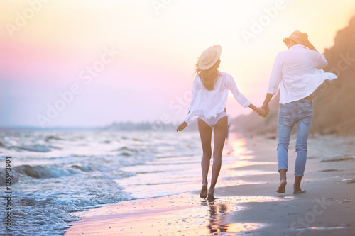 Young happy couple walking ...
