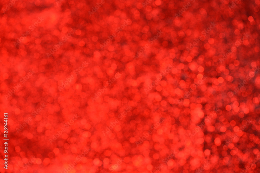 Red background with shimmering glitter - Defocused lights Red background with shimmering glitter - Defocused lights