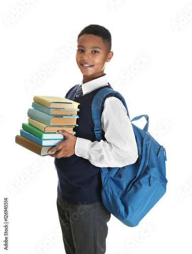 Cute teenager with books on...