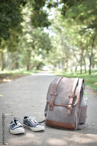 Backpack travel and shoe in nature concept travel in holiday.