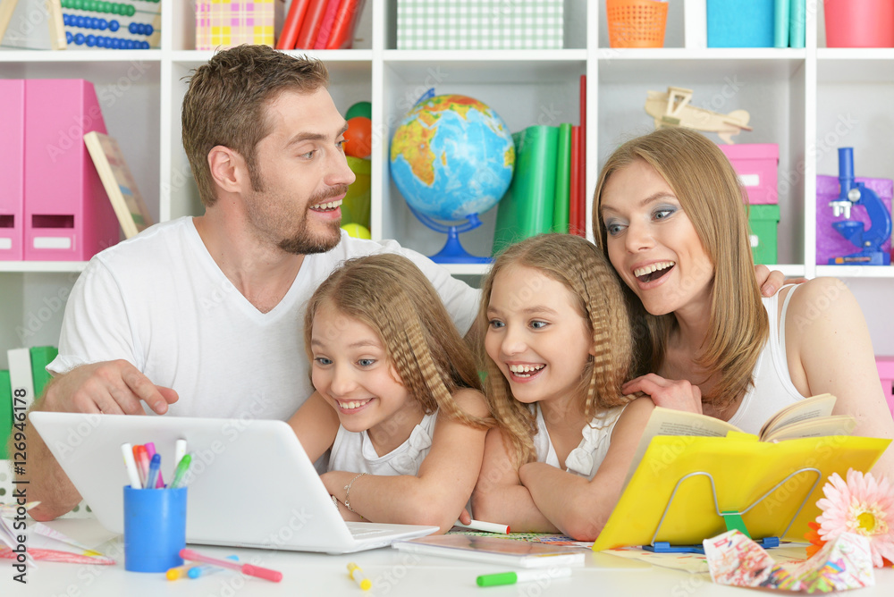 Fototapeta premium happy family with laptop