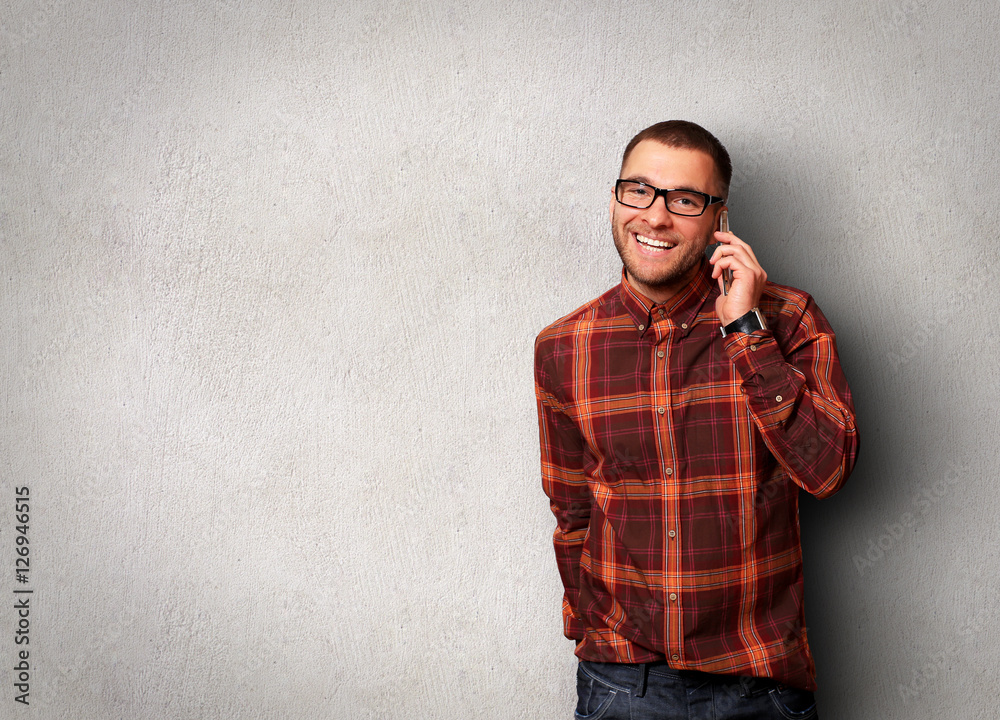 Man calling on mobile phone and smiling Man calling on mobile phone and smiling