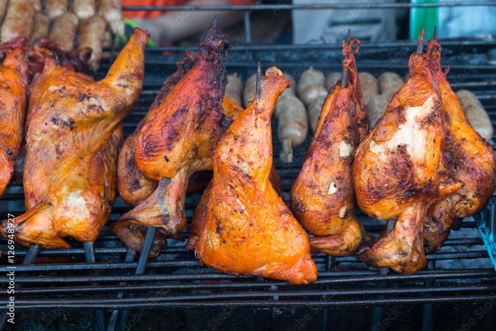 Naklejka premium Grill chicken on roaster.