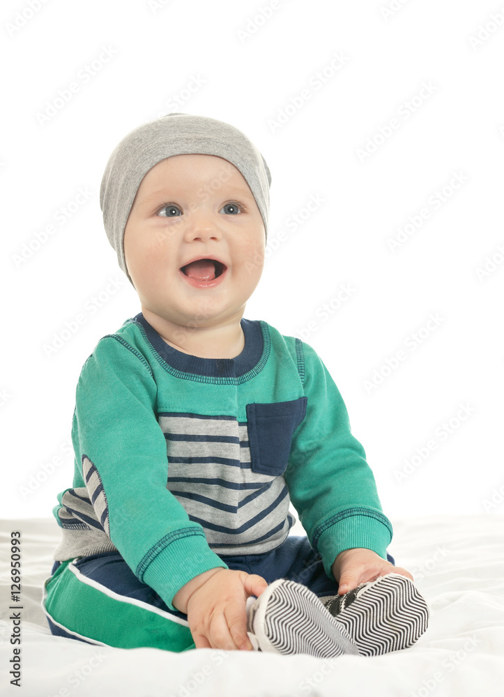 Baby boy sitting on a white background Baby boy sitting on a white background