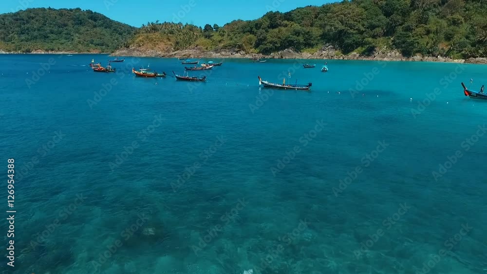 Aerial: Swimming at the beach near the boats. Aerial: Swimming at the beach near the boats.