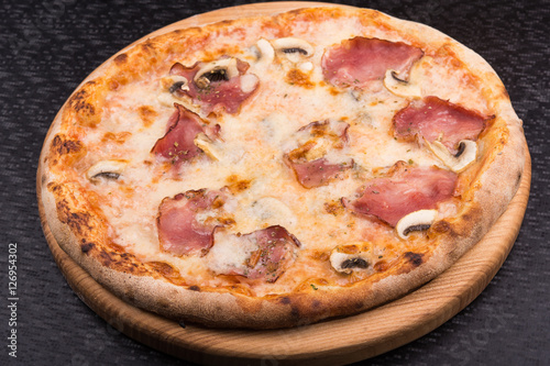 tasty italian pizza with bacon and mushrooms