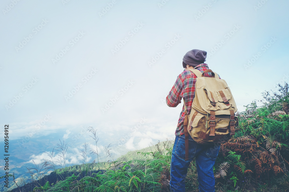 Photographer is taking a picture in mountains Photographer is taking a picture in mountains