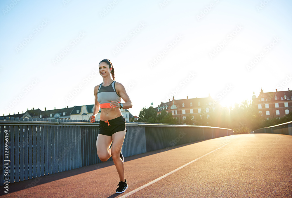 Athletic young woman enjoying a morning run