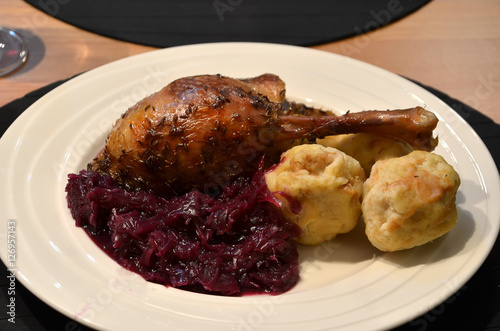 roasted goose with cabbage and dumpling on the table detail photography