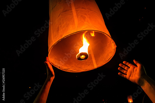 A tourist releasing a lantern, Loy Krathong 2016, Chiang Mai