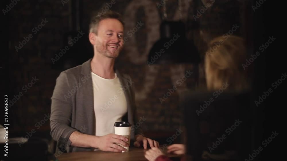 Man in take away coffee shop with a cup of hot coffee Man in take away coffee shop with a cup of hot coffee