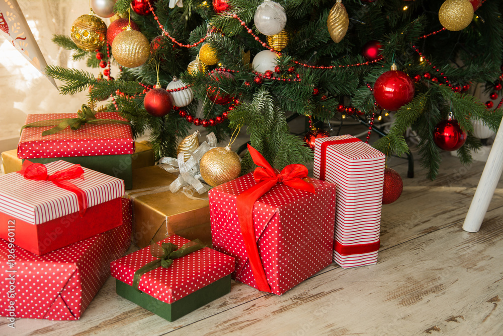 Fotografie Gifts under a Christmas spruce