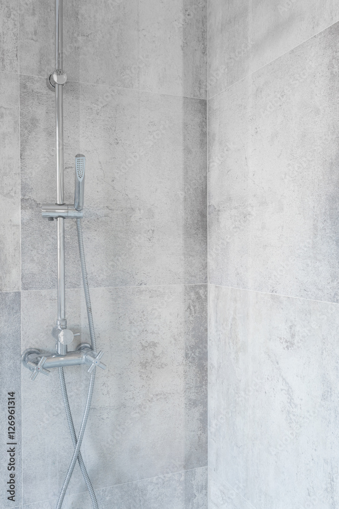 Spacious shower with concrete tiles