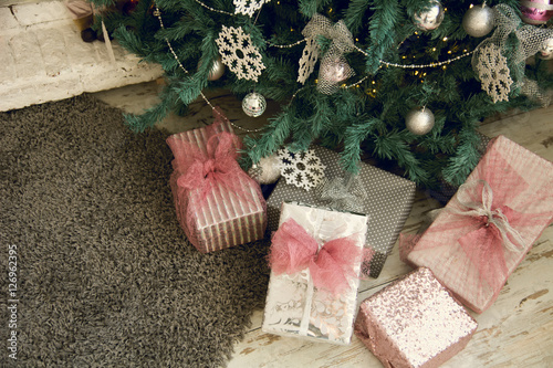 Close-up of Christmas presents under photo