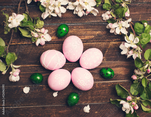 Easter. Colorful Easter eggs with spring blossom flowers on rustic