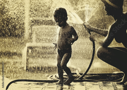 B/W photo of mother, son and water drops