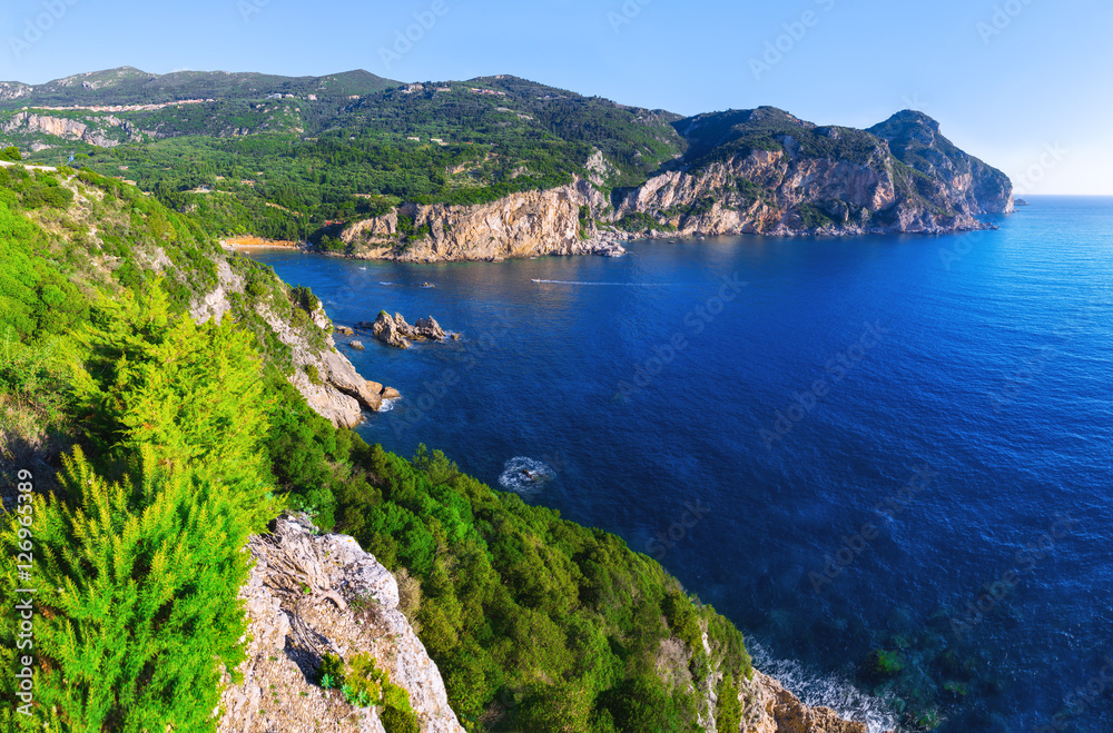 Fototapeta premium Landscape of beach in close bay with crystal clear azure water.