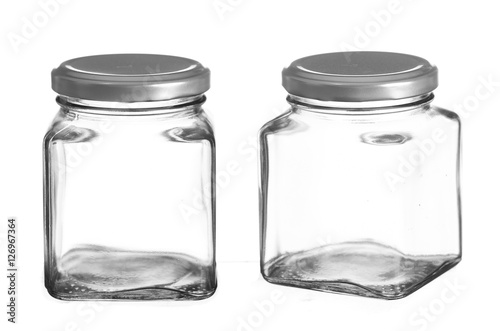 Empty glass jar isolated on white background