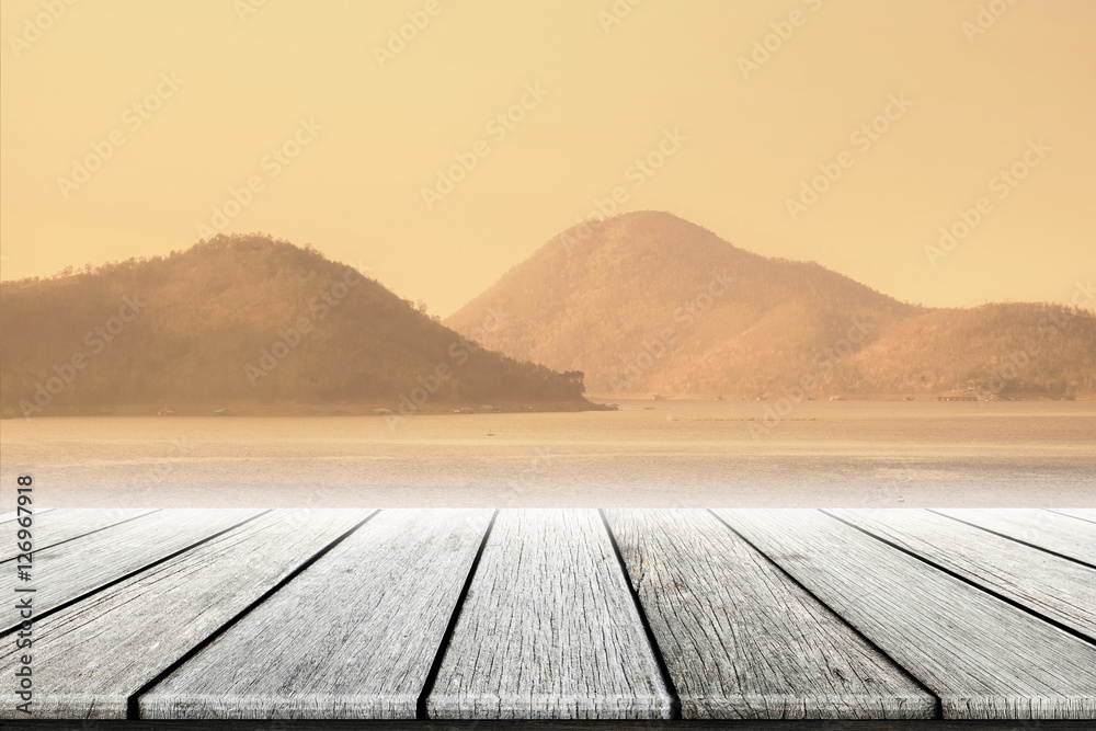 blurred lake nature background at evening with wooden floor blurred lake nature background at evening with wooden floor