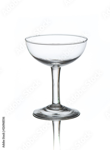 Empty cocktail glass on white background