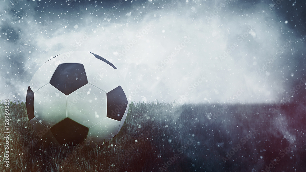 Soccer ball in grass as grunge sports background