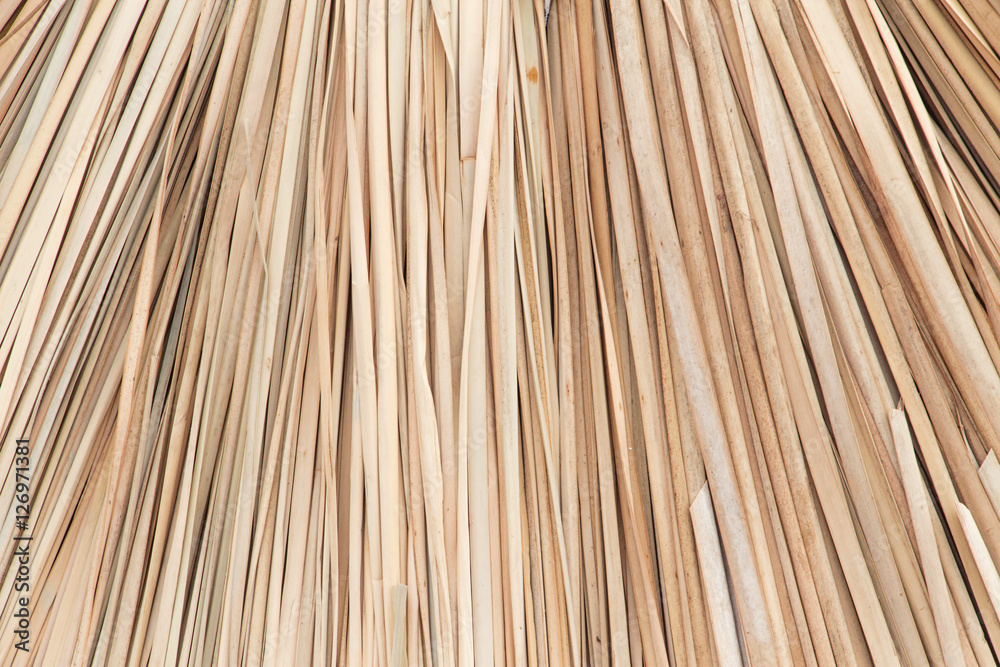 Wicker straw umbrellas closeup background Wicker straw umbrellas closeup background
