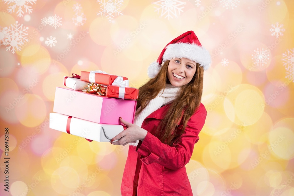 Beautiful woman in santa costume holding a christmas gift Beautiful woman in santa costume holding a christmas gift