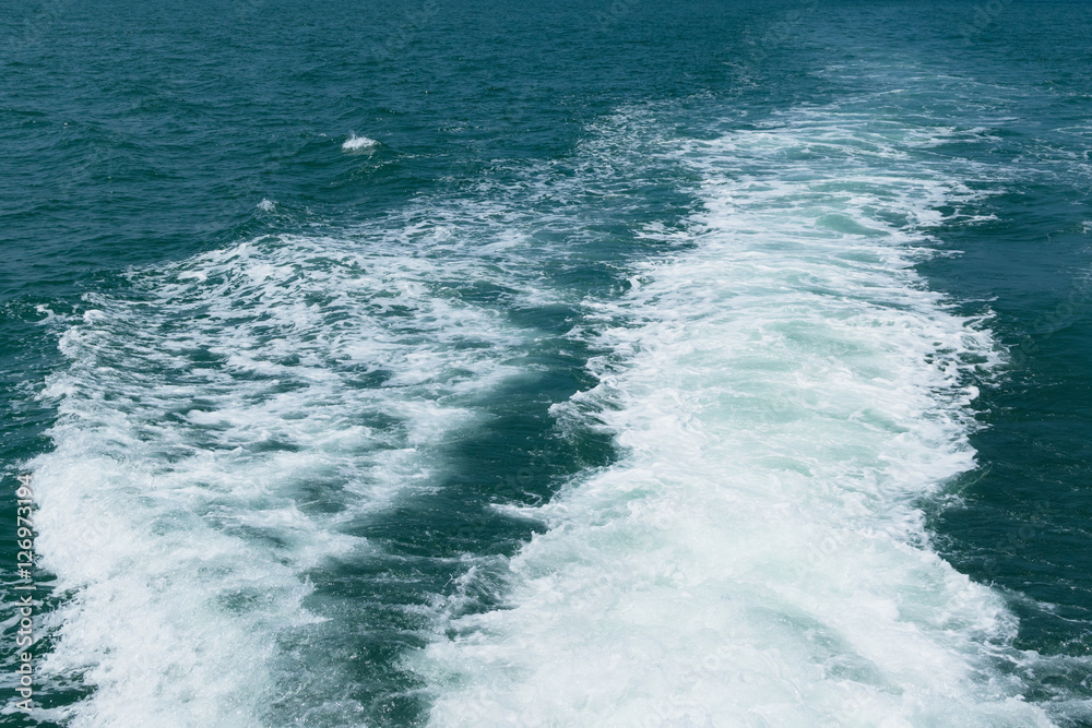Fototapeta premium Close up foam wave on sea from boat. nature background texture for graphic resource.