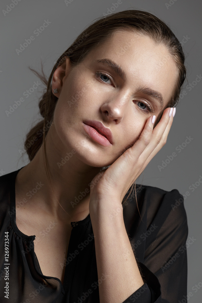 Fashion style model in black shirt and pants posing in the studi Fashion style model in black shirt and pants posing in the studi