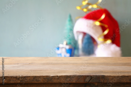 Empty rustic wooden table in front of christmas background