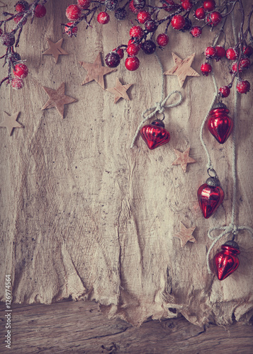 Old parchment and chrostmas ornaments photo