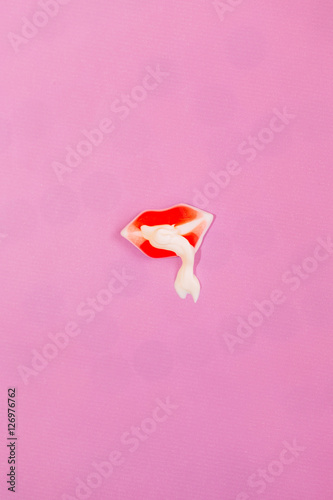 colorful candy sweet mouth with mayo on vibrant background, minimalism