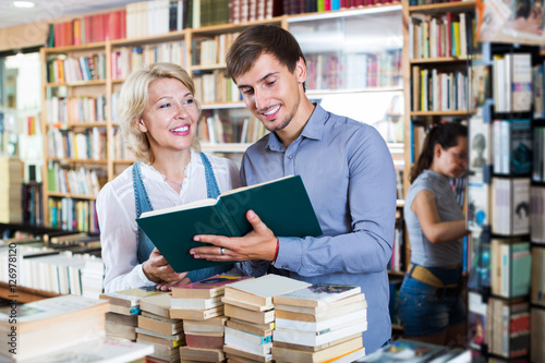 Woman and man having books