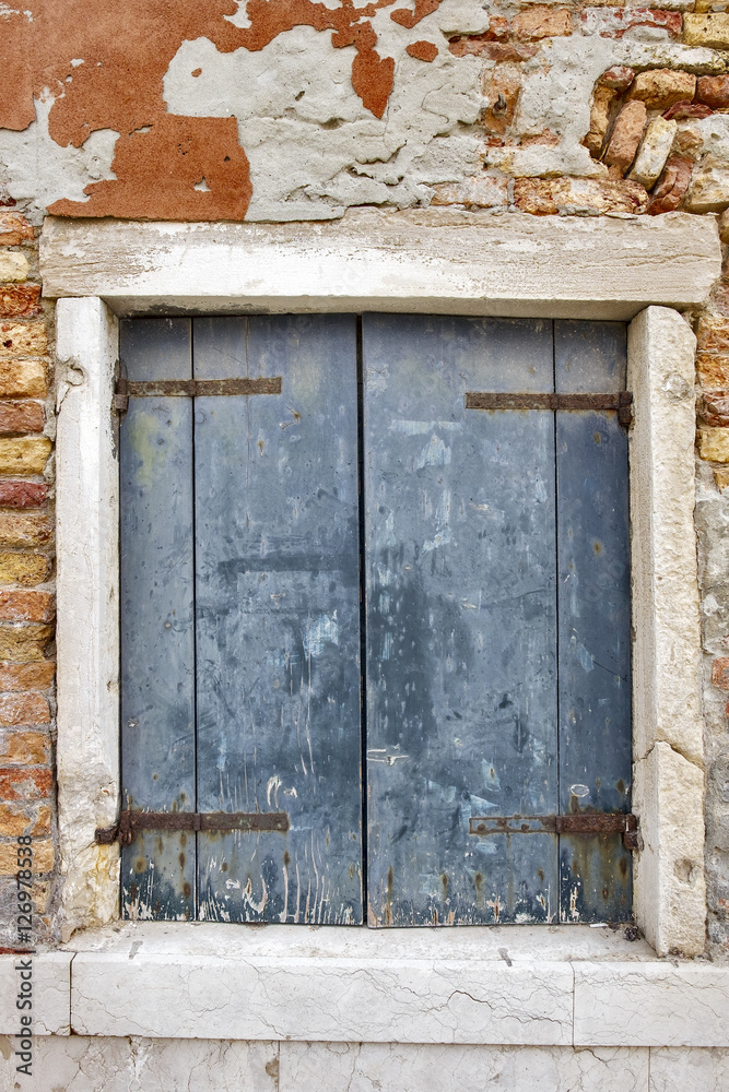 Venetian Old blue window at Murano island. Venice, Italy.