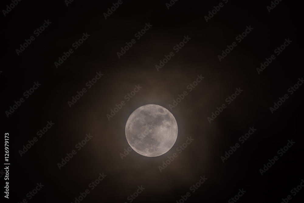 Rare full moon not seen since 1948 through a veil of high clouds Rare full moon not seen since 1948 through a veil of high clouds