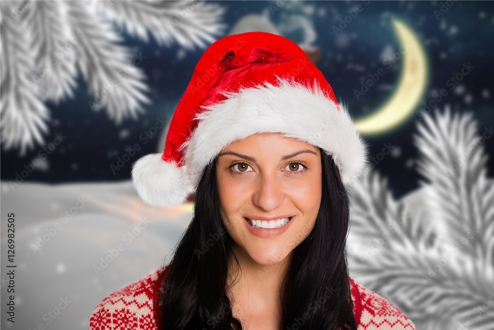 Portrait of beautiful woman in santa hat smiling at camera Portrait of beautiful woman in santa hat smiling at camera