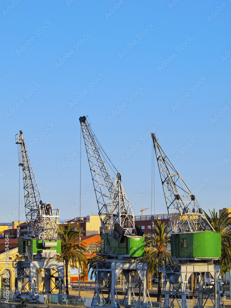 Spain, Catalonia, Tarragona, View of the port cranes.