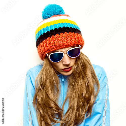 Brunette Pom pom hat and stylish sunglasses. Snowboard Warm fash © Porechenskaya